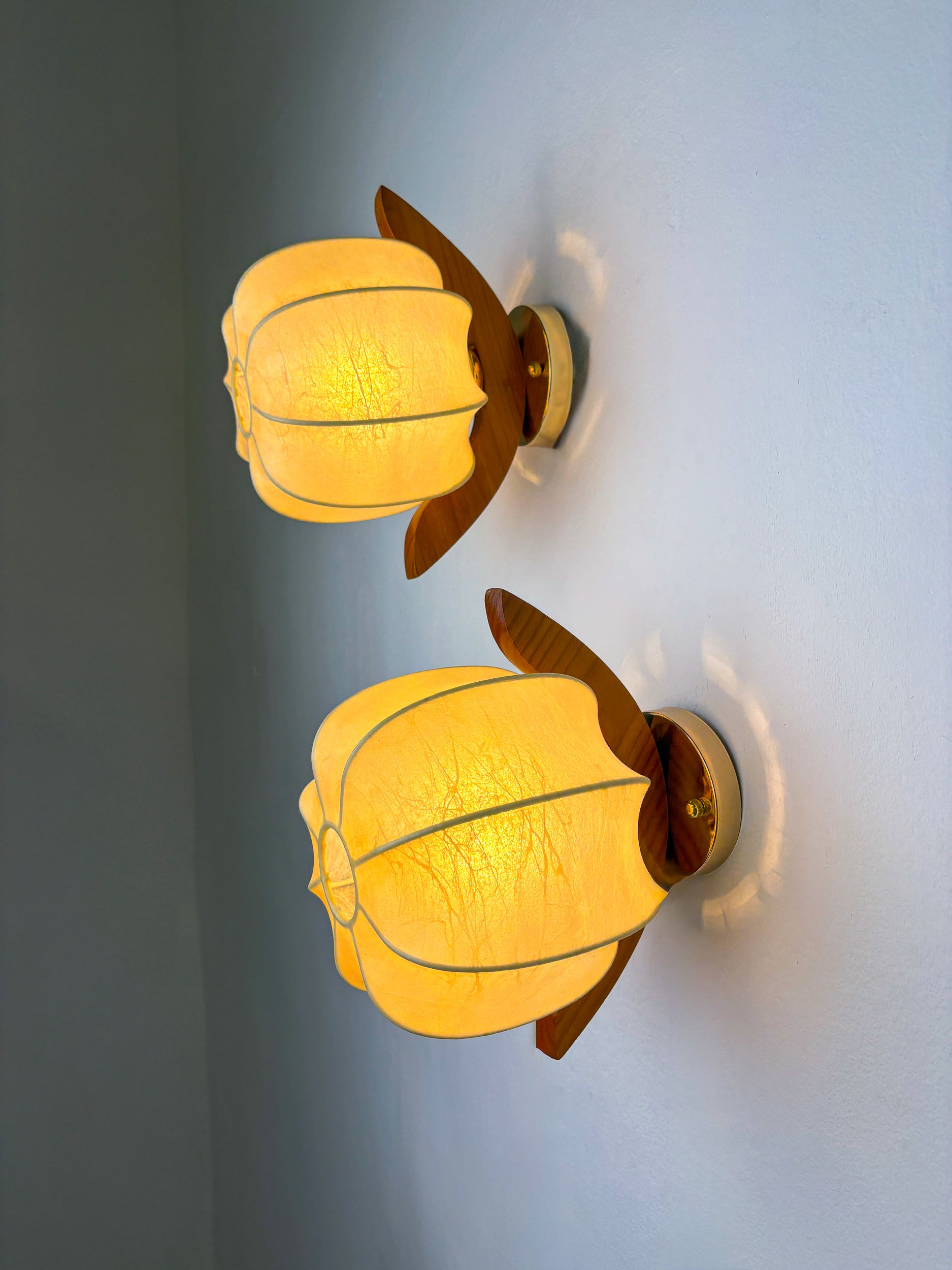 Pair of Italian "Cocoon" wall lights, resin and pine wood, 1970s
