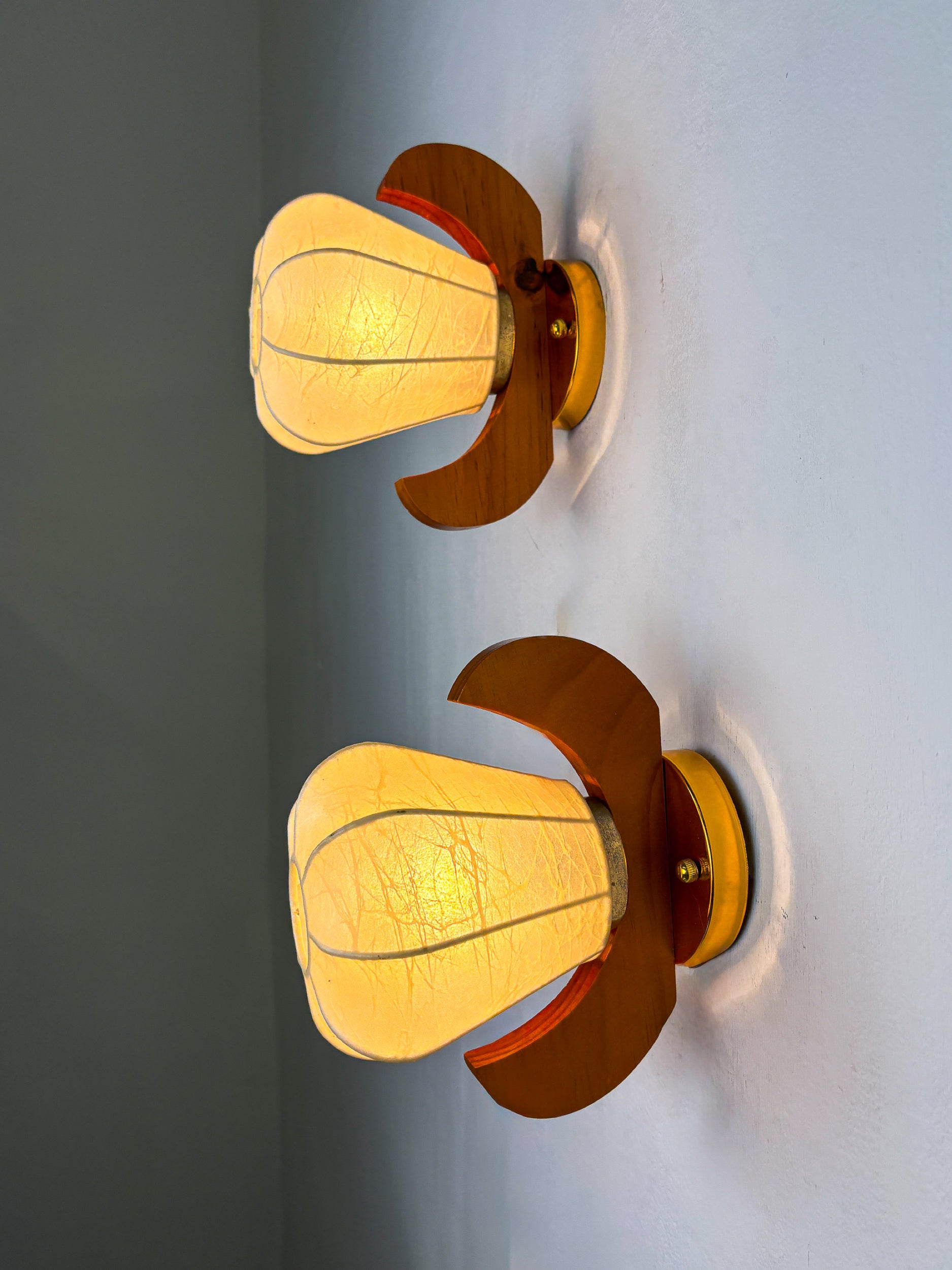 Pair of Pear-shaped "Cocoon" wall sconces, resin and pine wood, Italy, Circa 1970's