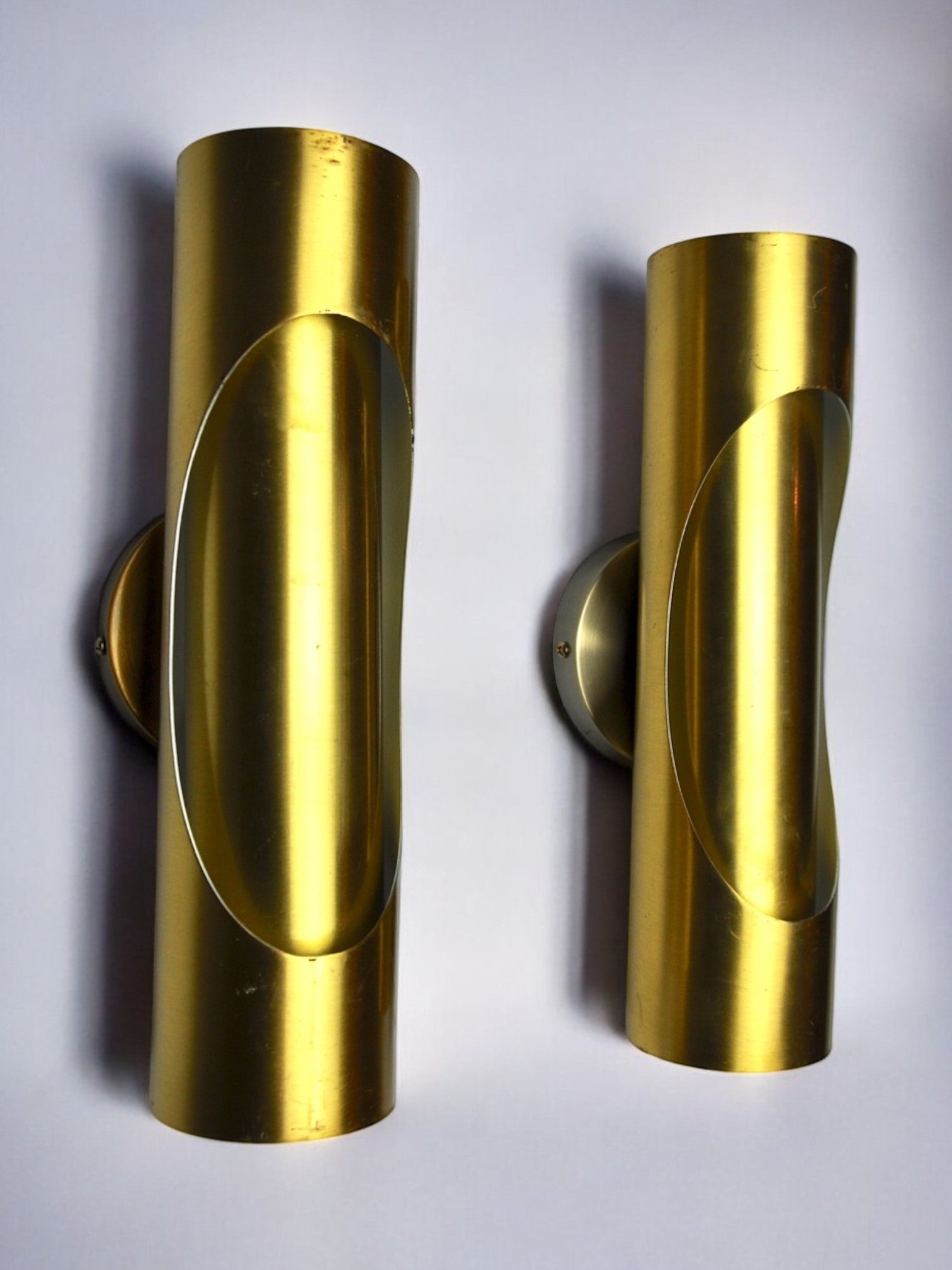 Pair of Raak tubular wall lamps in brass, 1970