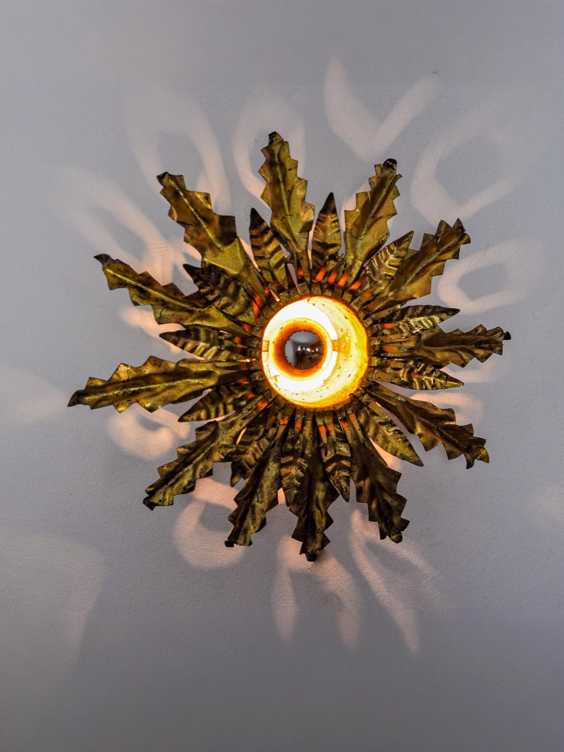 Brutalist sun wall lamp, metal and gold leaf, Italy, 1960