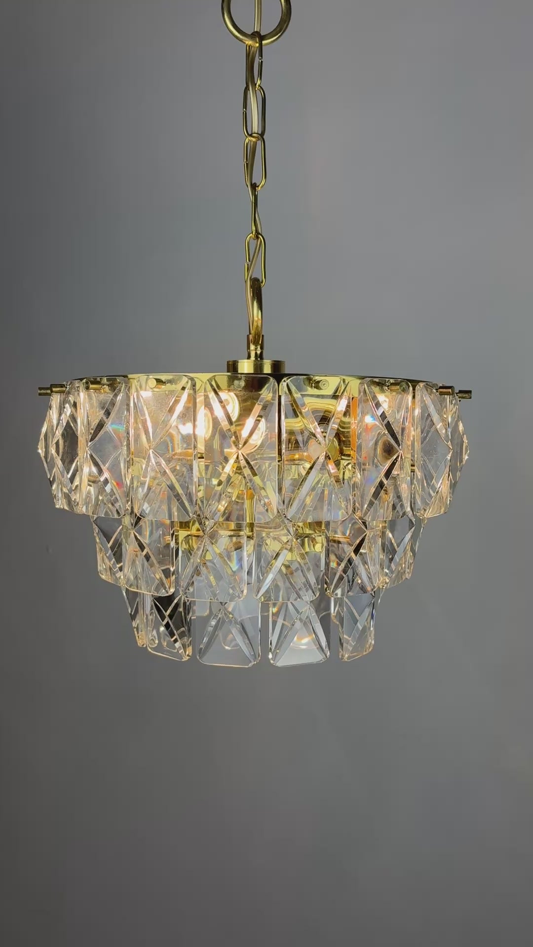Load video: Kinkeldey 3-Tier Cut Crystal Chandelier, Gilt Brass, Germany, 1970