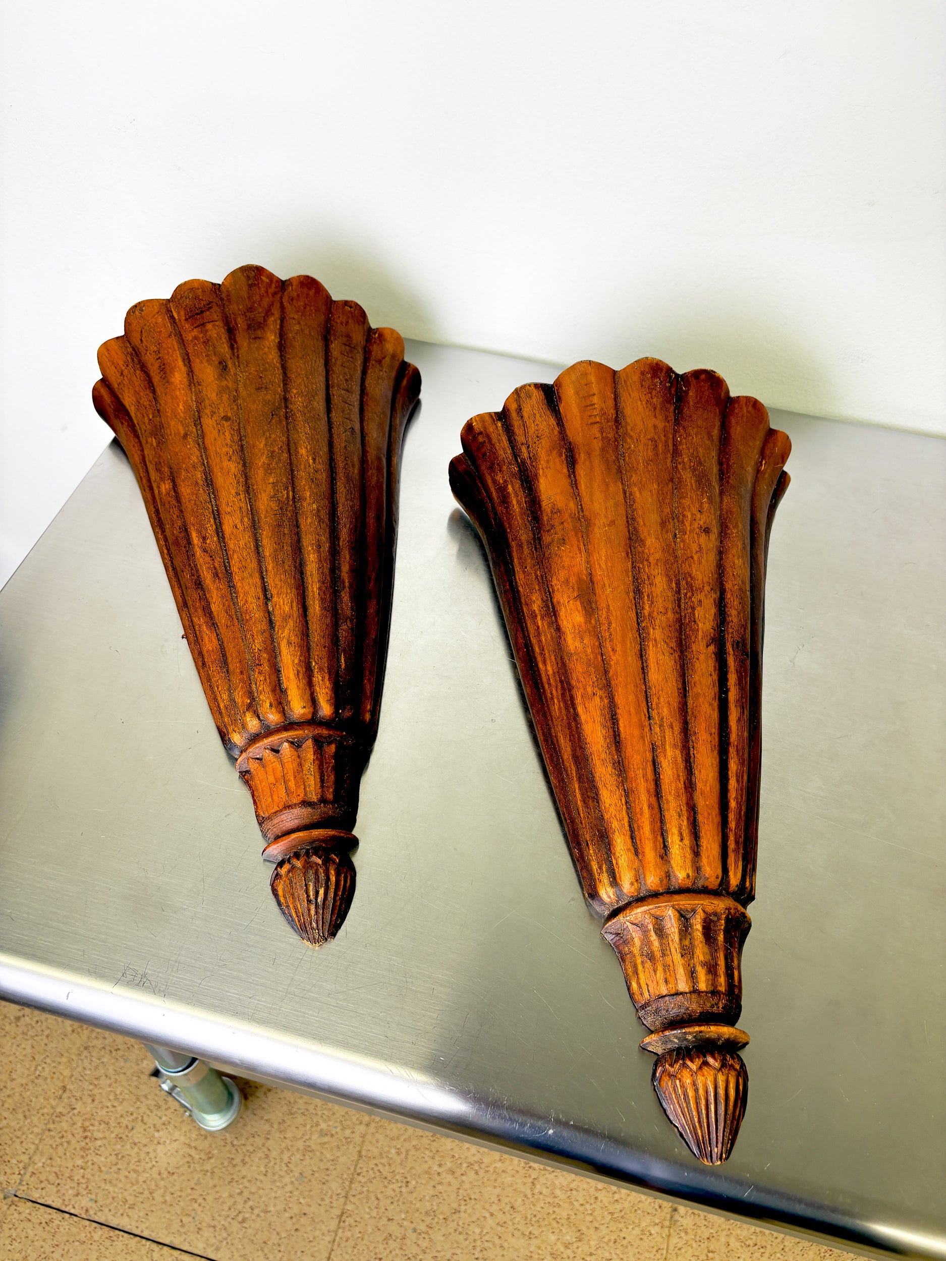 Pair of Art Deco carved wood wall sconces, France, 1930's