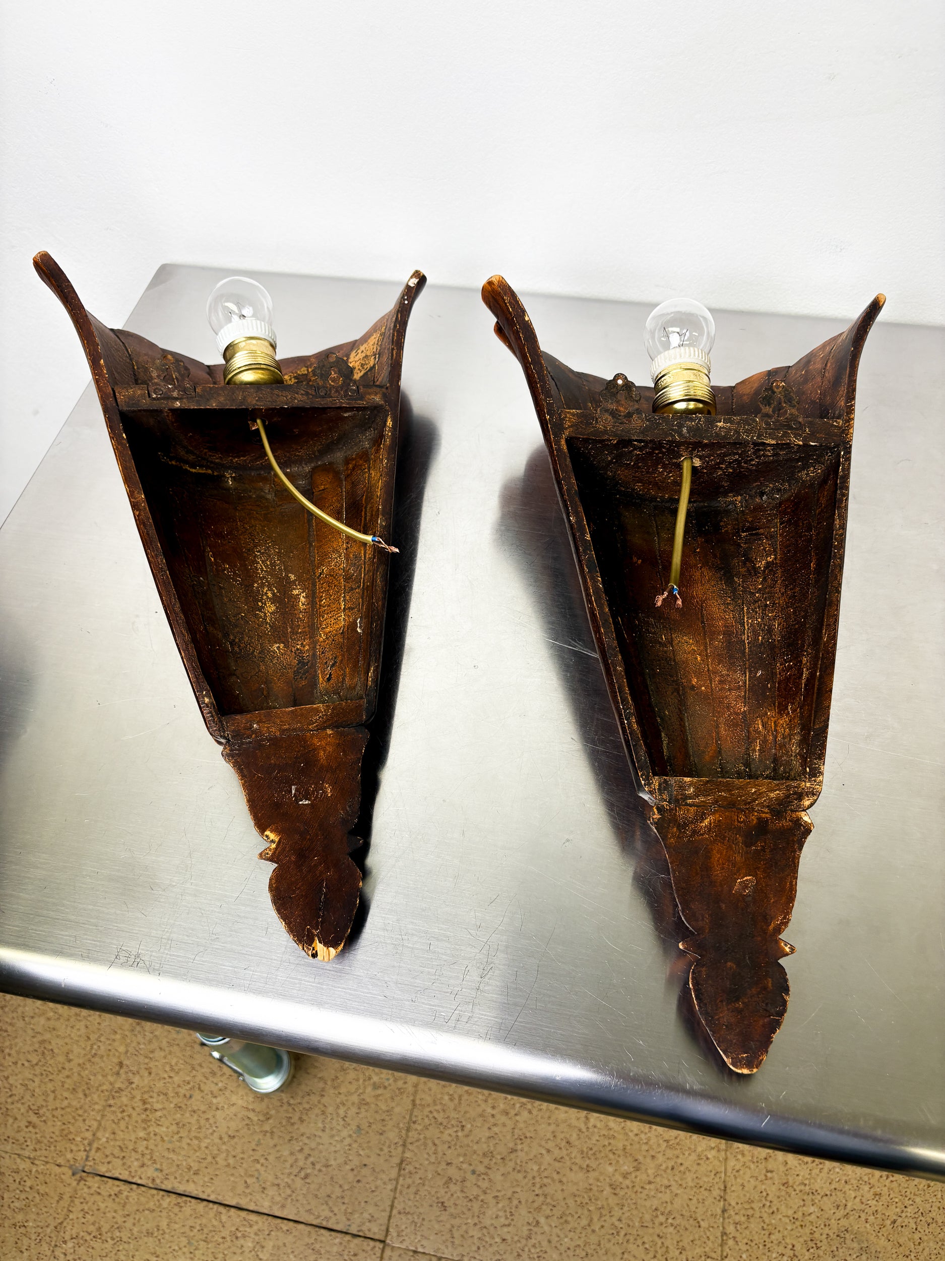Pair of Art Deco carved wood wall sconces, France, 1930's